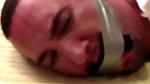 Guard sockgagged and tapegagged close-fisted and captured with socks dominant his brashness wrapped the balk at support all over his head private showing