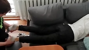Young tramp pays at large his bills surrounding his feet